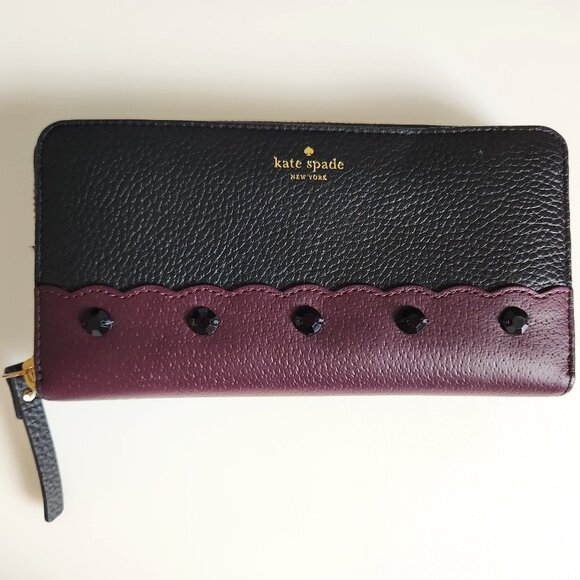 KATE SPADE NEW YORK PUBBLED BLACK AND PURPLE COW LEATHER ZIP AROUND WALLET - Picture 1 of 5